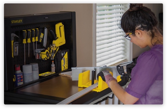 Quality, Reliability, Innovation, and Value Woman using Stanley tools
